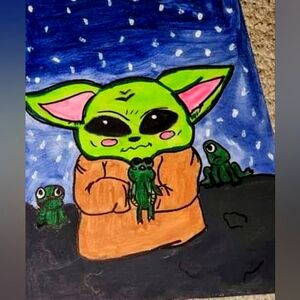 Baby yoda holding frogs.